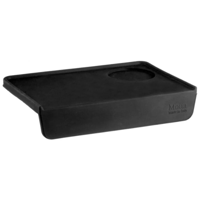 Angled view of the Motta rectangular edge tamping mat with raised lip and tamper slot