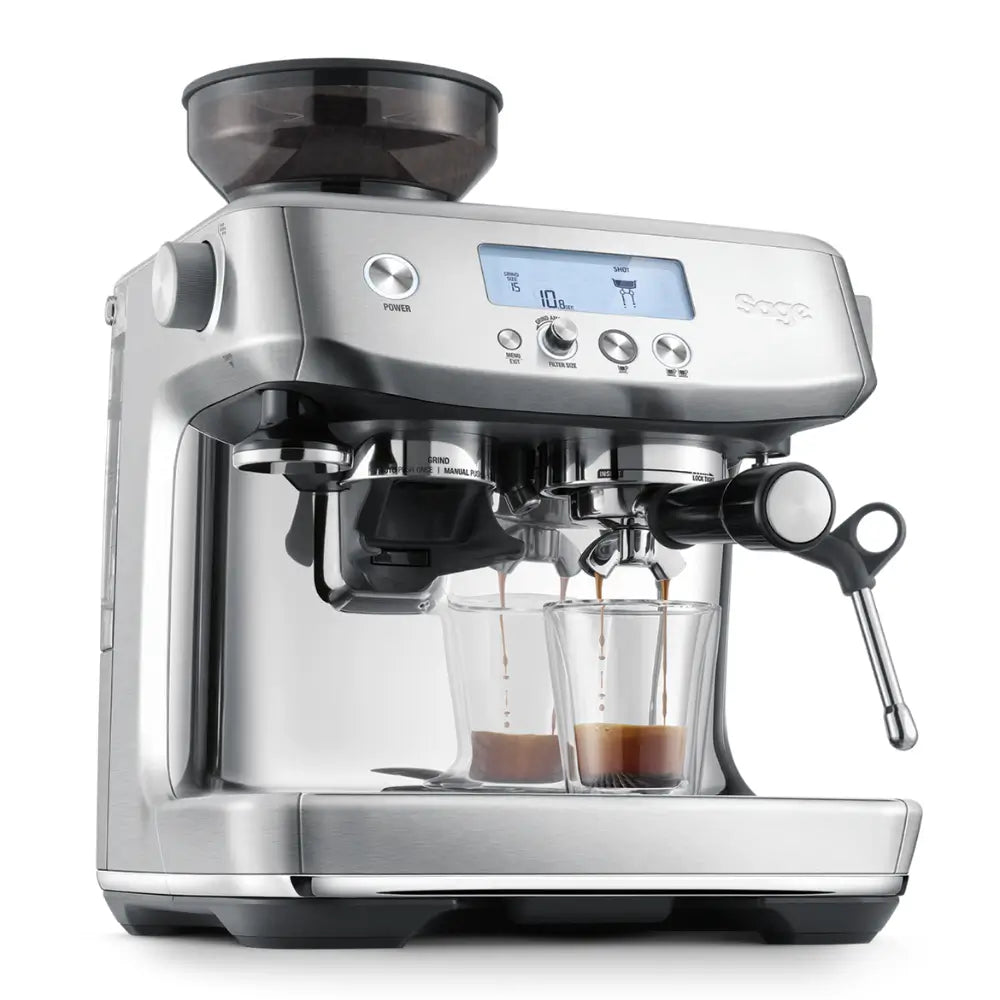 The Sage Barista Pro actively pouring a rich double espresso shot into two glass cups.