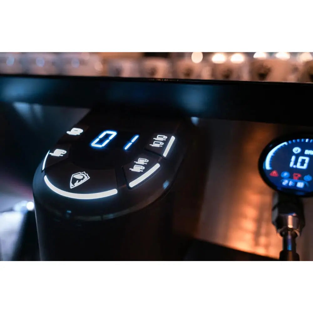 Detailed close-up of the Sanremo F18's illuminated digital control panel, showing the programmable shot timer and dose buttons.