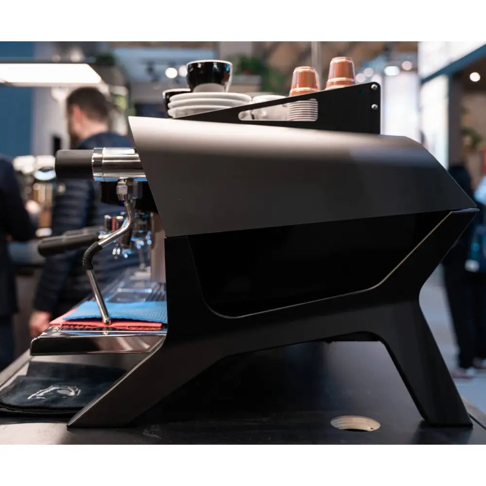 Dynamic side profile of the black Sanremo F18 MB, emphasizing its distinctive angular side panels.