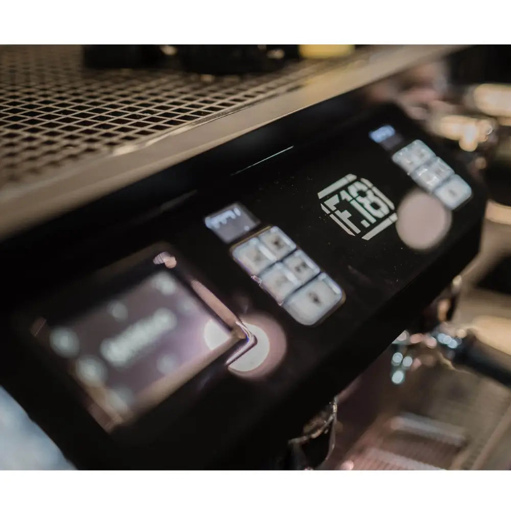 Close-up of the F18 Multi Boiler's digital touchscreen and programmable group controls.