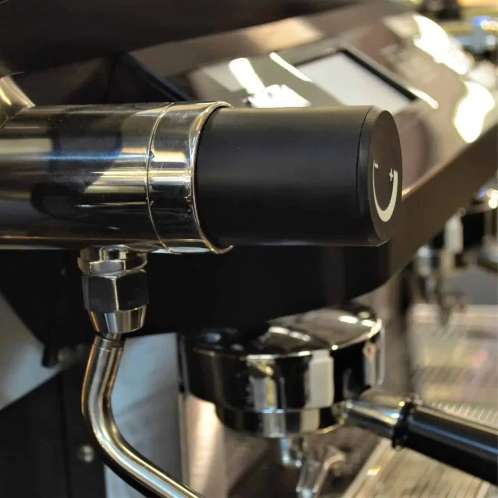 Detailed close-up of the rotary steam valve and cool-touch steam wand on the Sanremo F18 MB machine.