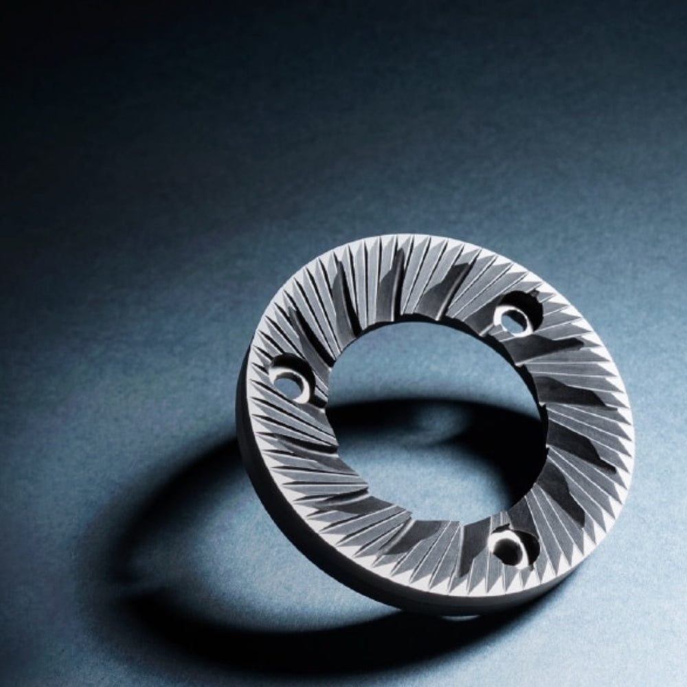 Detailed view of the precision 64mm flat steel burr for the Sanremo SR64 EVO Pro coffee grinder.