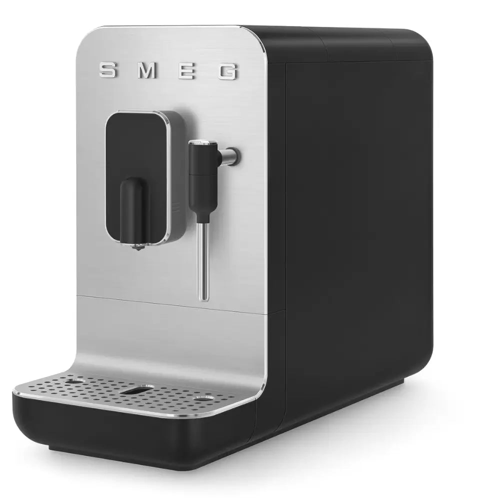 Angled front view of the SMEG BCC12 featuring the built-in grinder and stainless steel front panel.