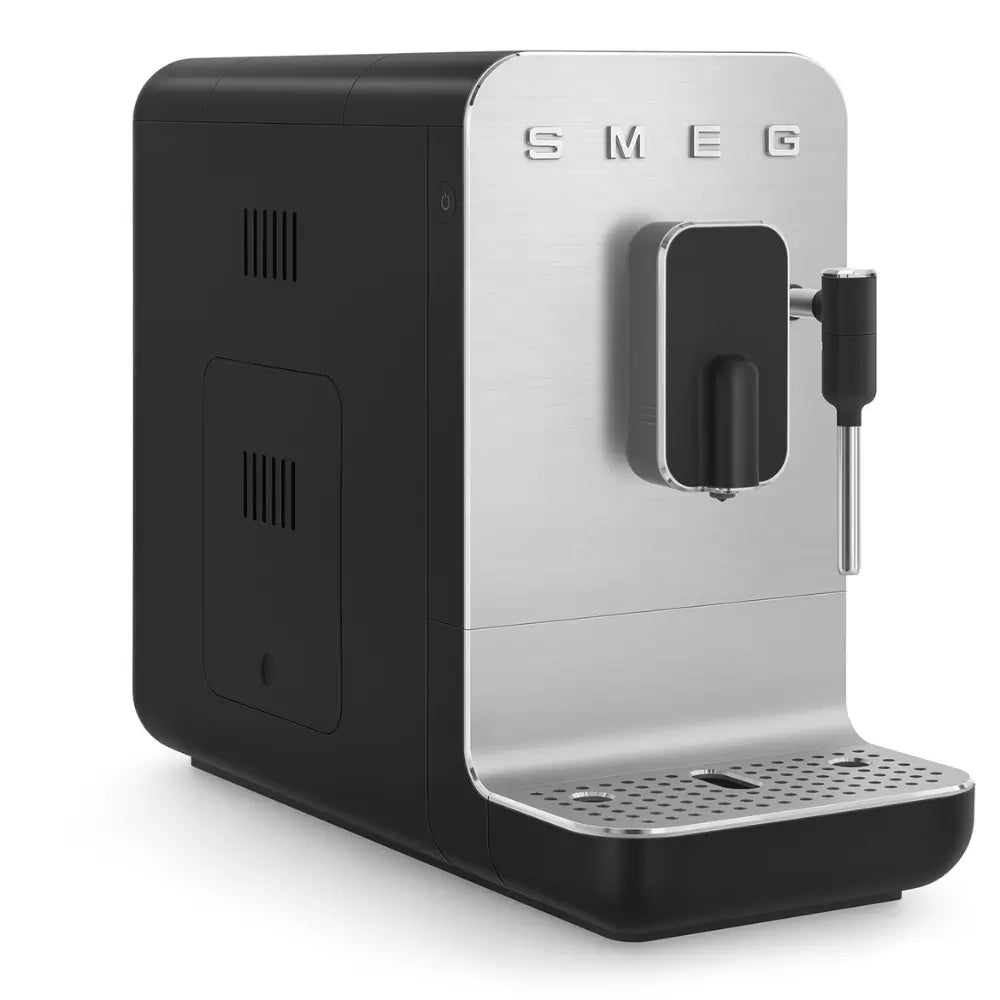 Angled rear view of the SMEG BCC12 bean-to-cup machine, showing the compact profile and controls.