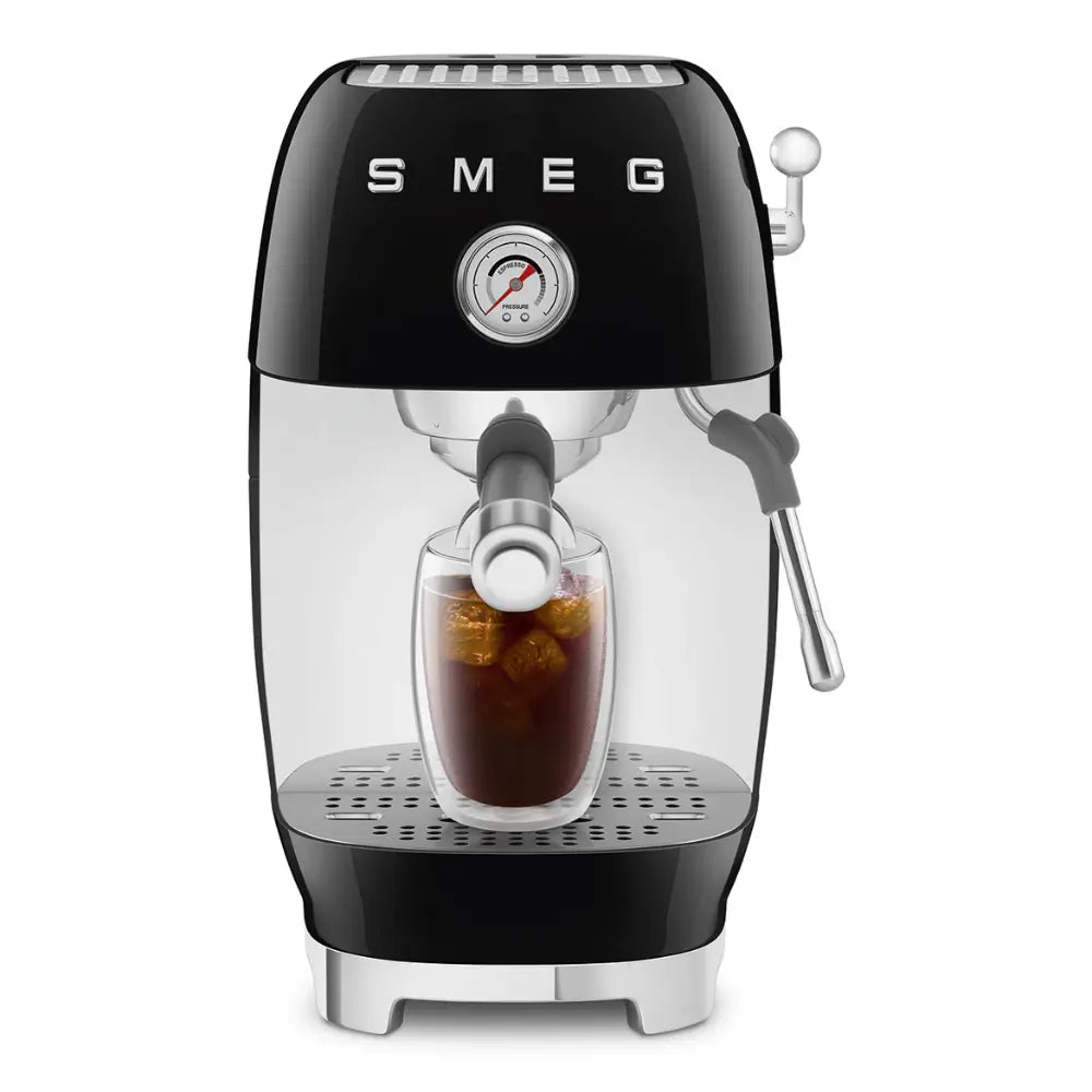 SMEG ECF03BLUK cold brew espresso machine dispensing coffee into a glass with ice.