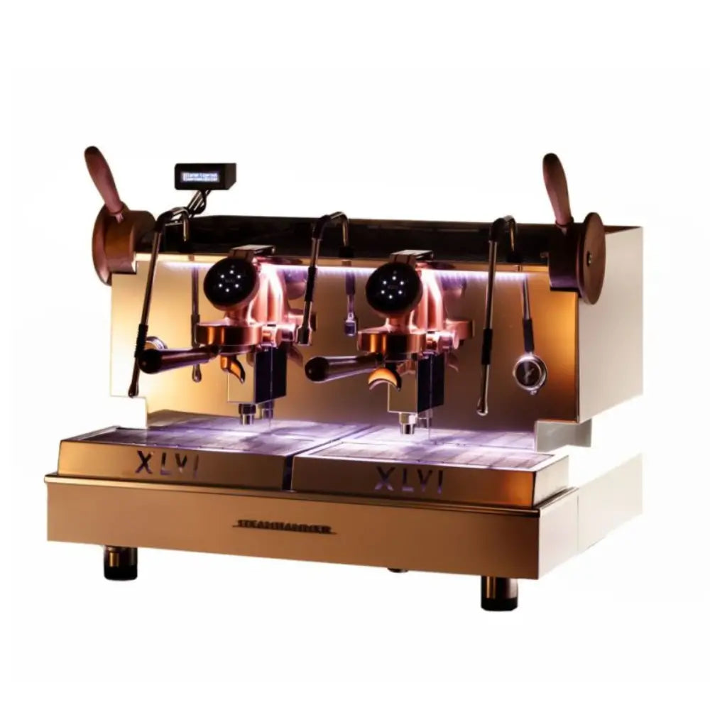 Full front view of the XLVI Steamhammer E 2 Group professional espresso machine in polished gold.